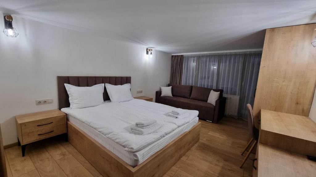 Postel nebo postele na pokoji v ubytování Guest House Gogemi