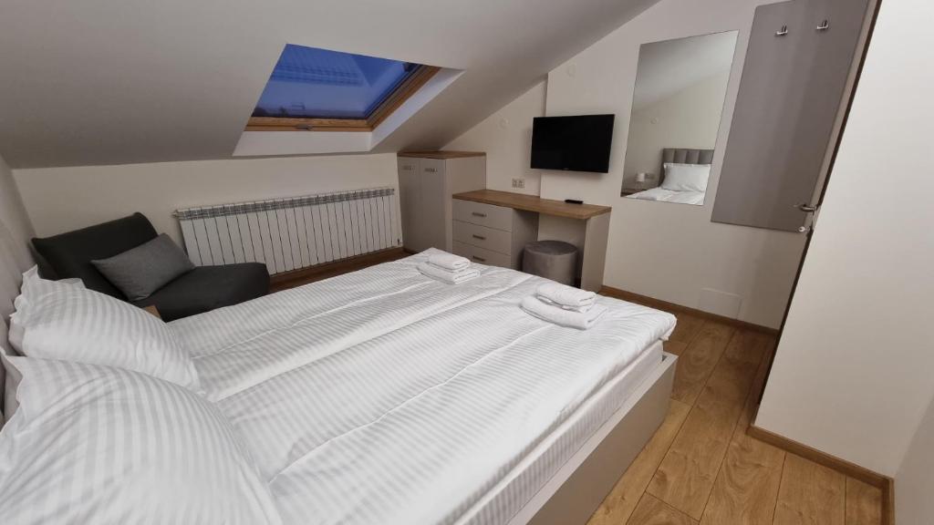 Postel nebo postele na pokoji v ubytování Guest House Gogemi