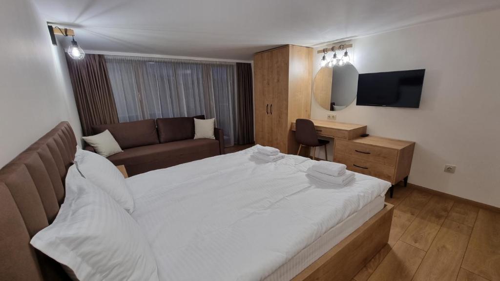 Postel nebo postele na pokoji v ubytování Guest House Gogemi