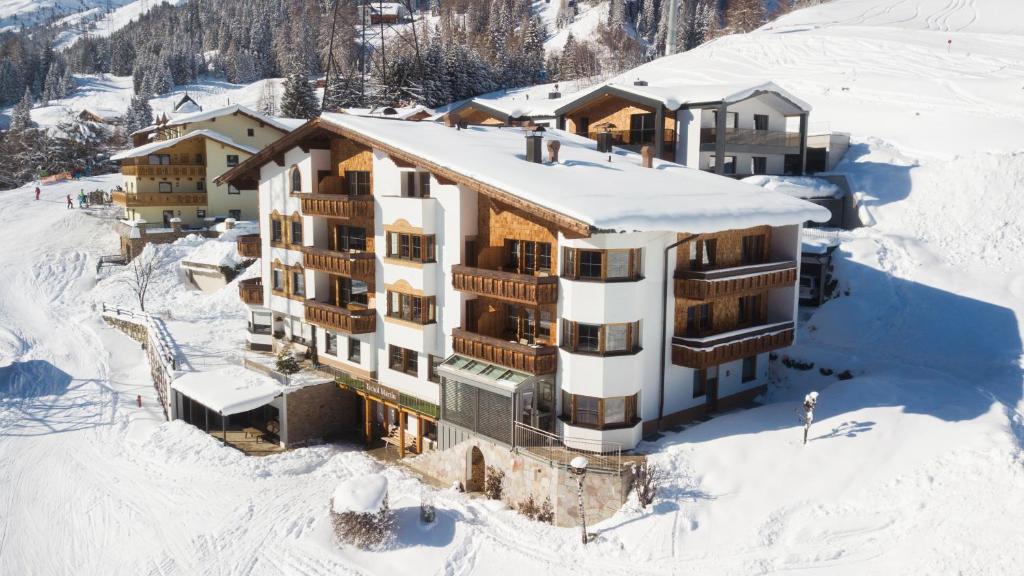 an aerial view of a building in the snow at Appartements Tschol Martin in Sankt Anton am Arlberg