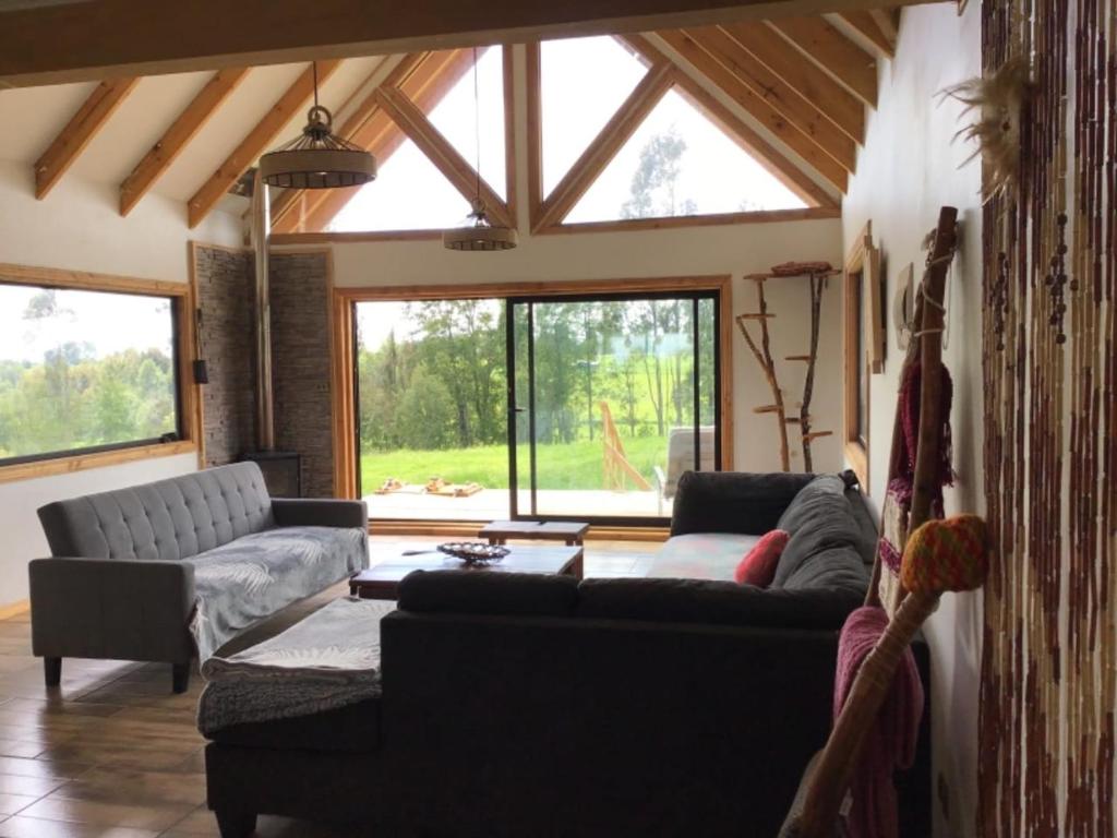 Posezení v ubytování Hostal & Domos Bello Horizonte