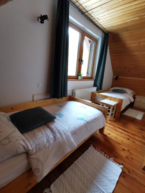 Postel nebo postele na pokoji v ubytování Chalet Via Mons