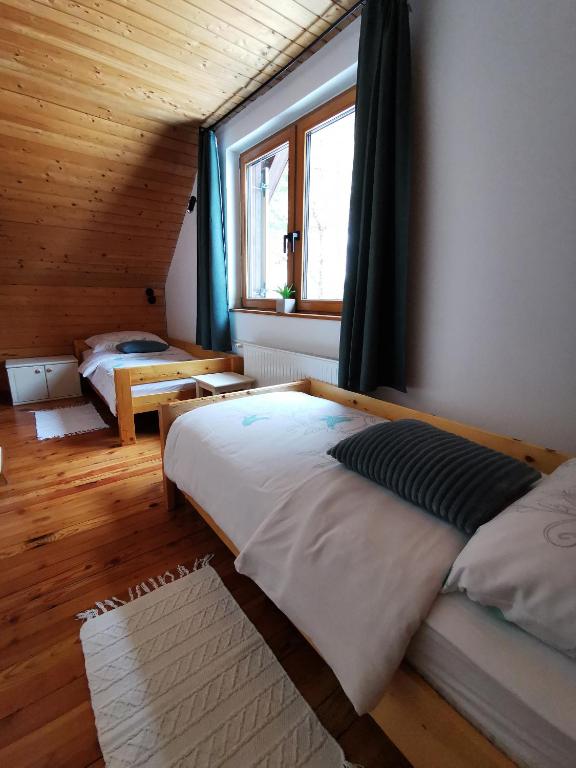 Postel nebo postele na pokoji v ubytování Chalet Via Mons