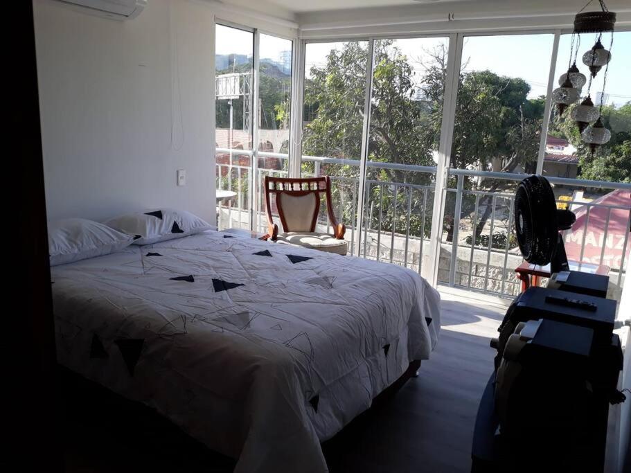 Postel nebo postele na pokoji v ubytování Con Piscina, Cómodo y acogedor Apartaestudio en el rodadero