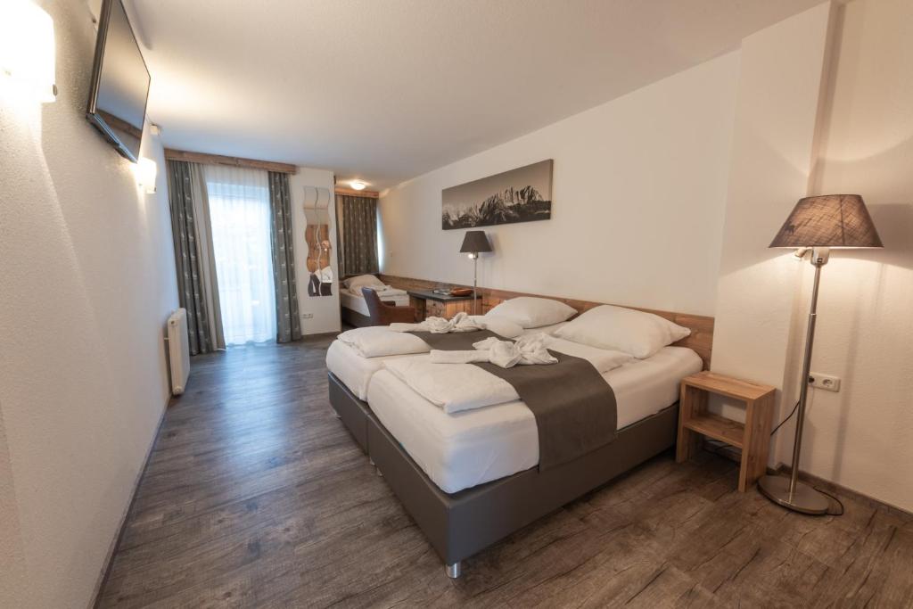 Letto o letti in una camera di Pension Rainer