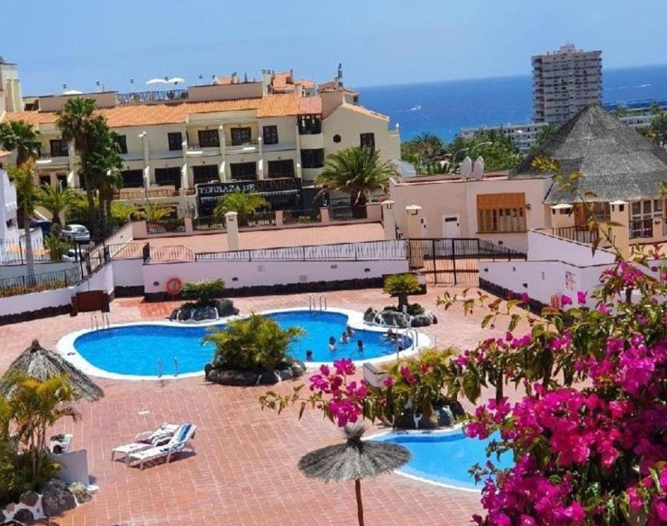 an aerial view of a resort with two pools at El Mirador Los Cristianos in Los Cristianos