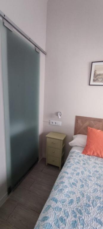 A bed or beds in a room at Centro de Sevilla