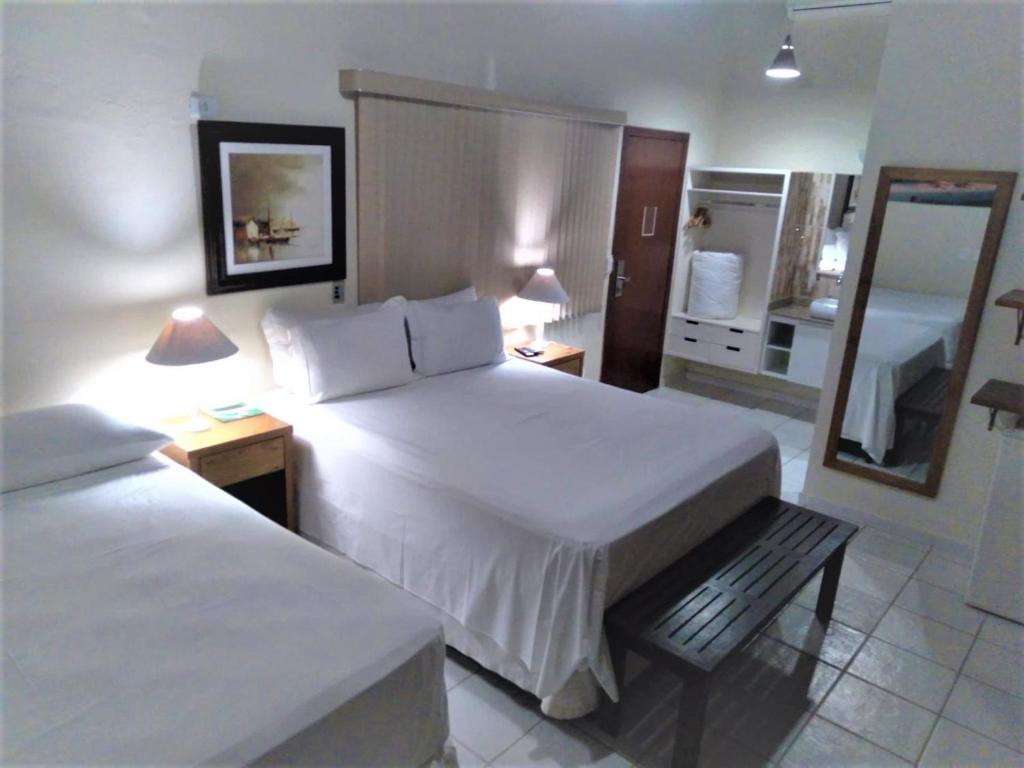 Cama ou camas em um quarto em Hiu Hotel