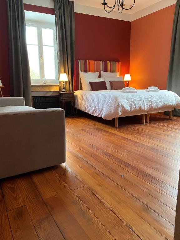 Posteľ alebo postele v izbe v ubytovaní LE CLOS DU TULIPIER