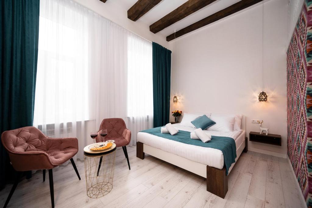 Posteľ alebo postele v izbe v ubytovaní Hive Family House