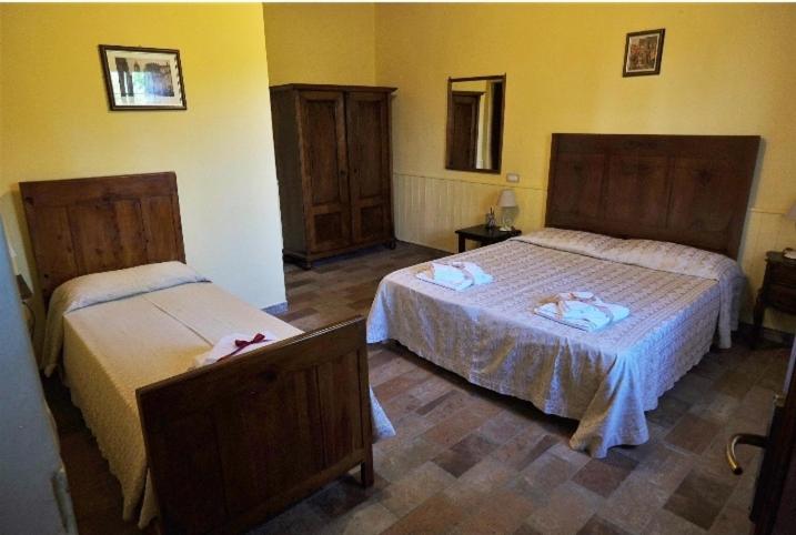 Postel nebo postele na pokoji v ubytování Podere Il Leccione