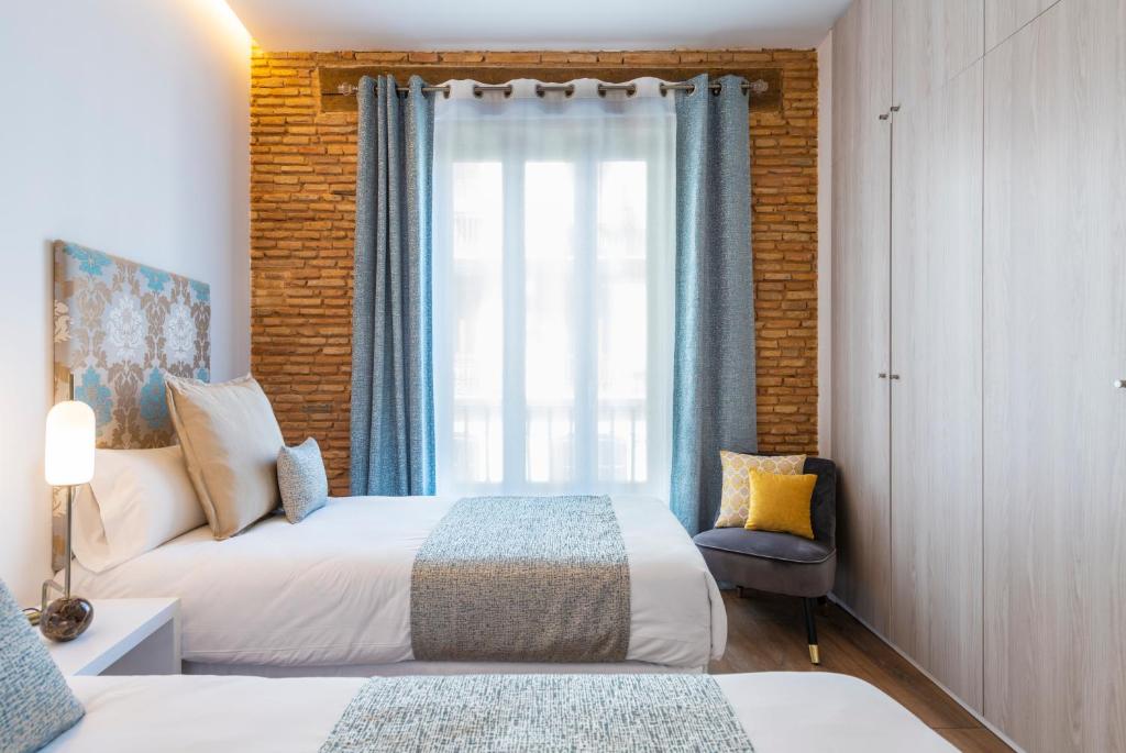 Postel nebo postele na pokoji v ubytování Torres de Serranos Apartments - TTdSSa VLC