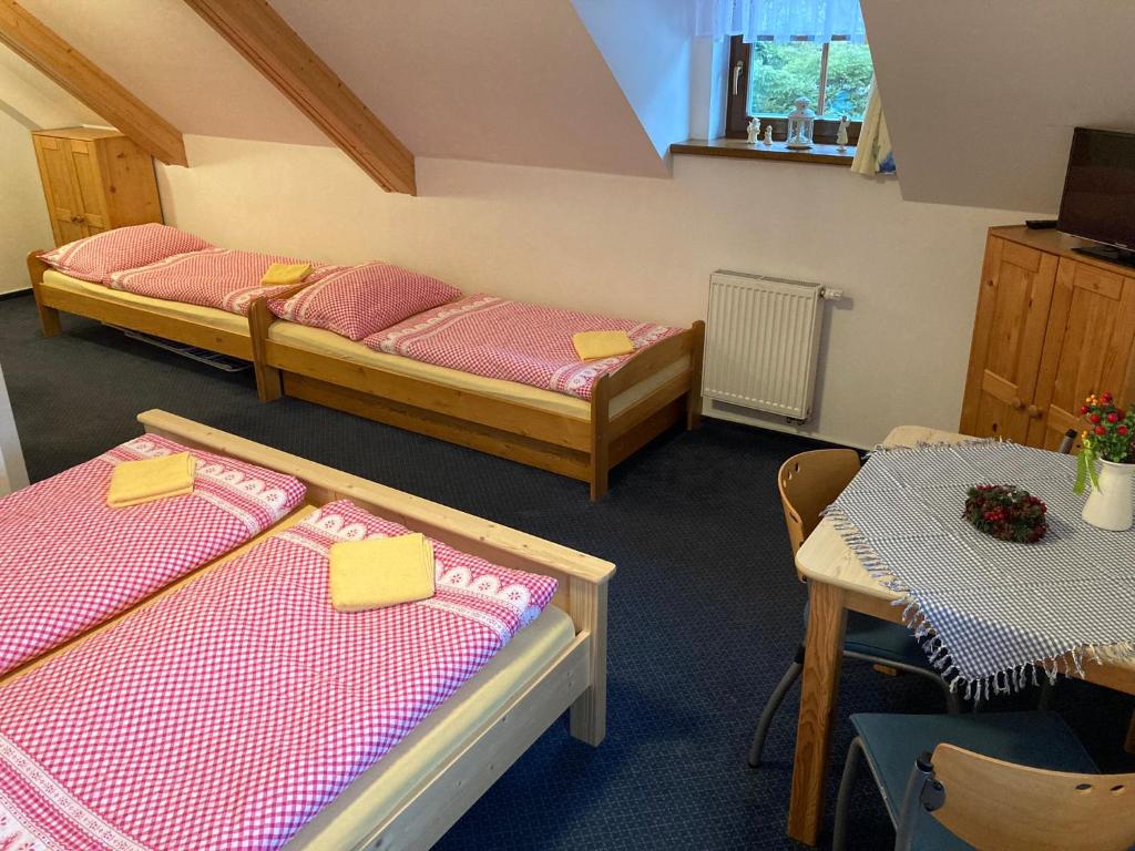 Postel nebo postele na pokoji v ubytování Penzion Eliška
