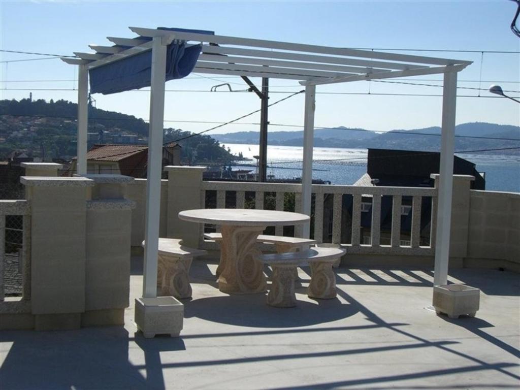 a picnic table and a pavilion on a deck at Apartment - 2 Bedrooms - 00119 in Vigo