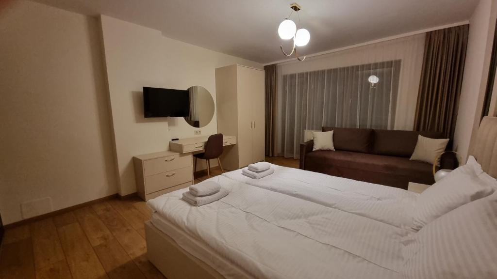 Postel nebo postele na pokoji v ubytování Guest House Gogemi