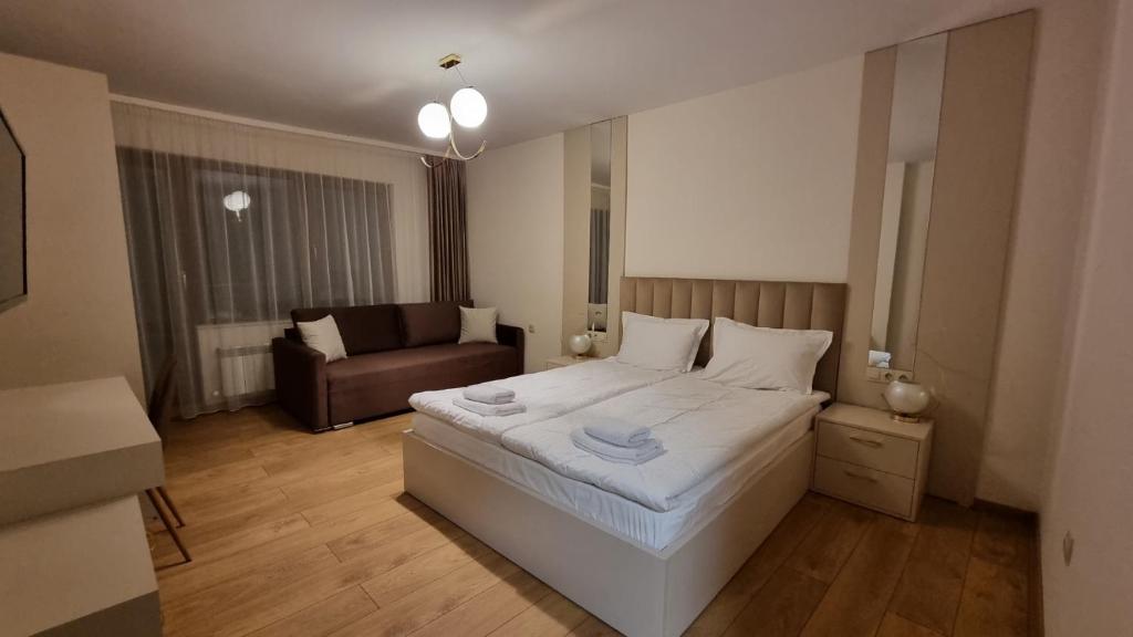 Postel nebo postele na pokoji v ubytování Guest House Gogemi