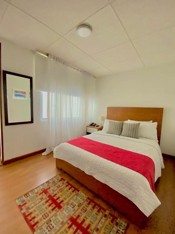 Postel nebo postele na pokoji v ubytování Hotel Maceo Chico