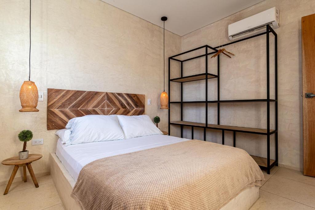 Postel nebo postele na pokoji v ubytování Soy Local Santa Marta