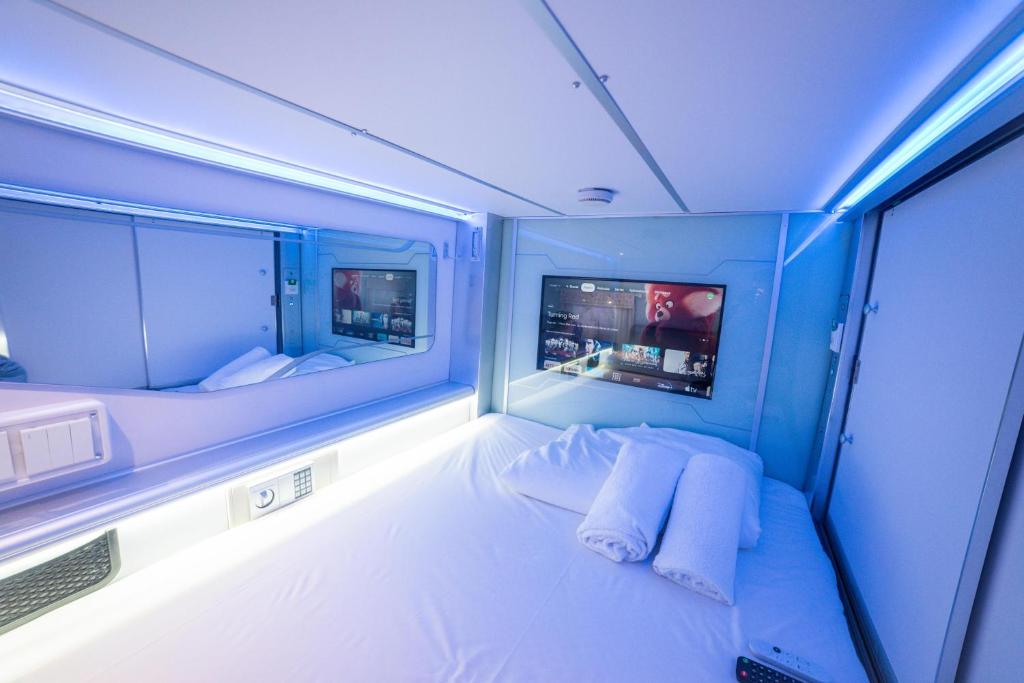 Postel nebo postele na pokoji v ubytování Optimi Rooms Madrid