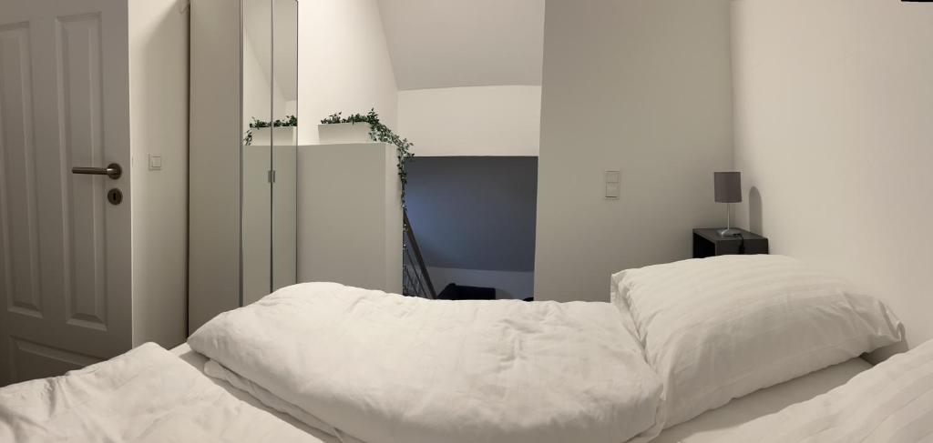 Postel nebo postele na pokoji v ubytování Mimi's Ostseeglück