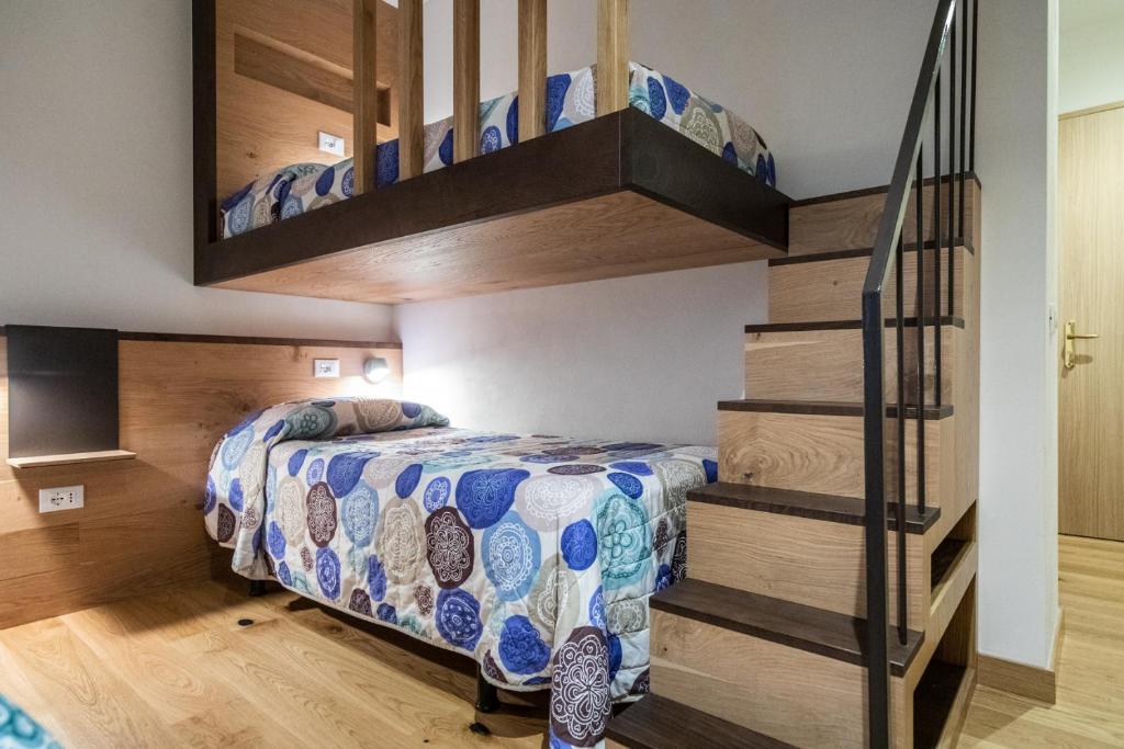 Postel nebo postele na pokoji v ubytování Grand Hotel Gortani