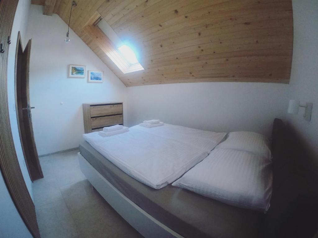 Postel nebo postele na pokoji v ubytování ALPS Apartments