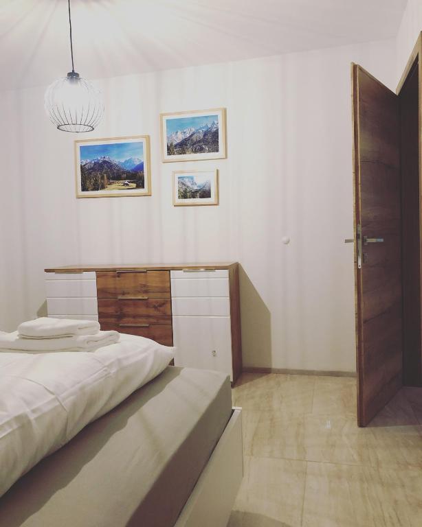 Postel nebo postele na pokoji v ubytování ALPS Apartments
