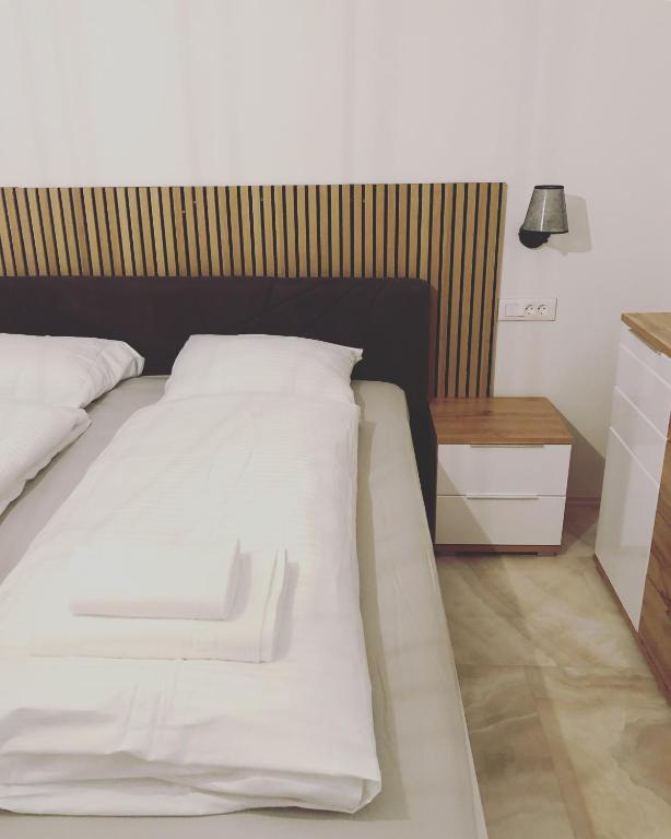 Postel nebo postele na pokoji v ubytování ALPS Apartments