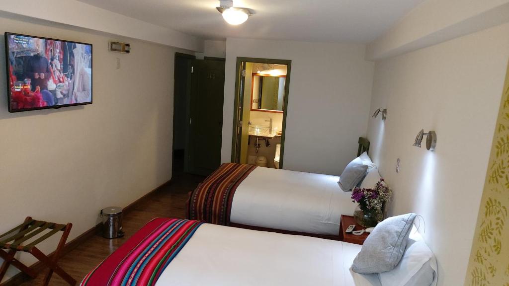 Postel nebo postele na pokoji v ubytování Hotel Pucara Machupicchu