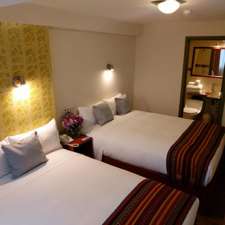 Postel nebo postele na pokoji v ubytování Hotel Pucara Machupicchu