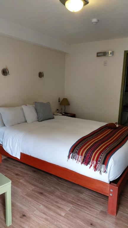 Postel nebo postele na pokoji v ubytování Hotel Pucara Machupicchu