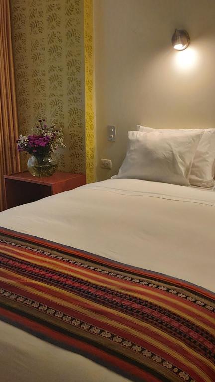 Postel nebo postele na pokoji v ubytování Hotel Pucara Machupicchu