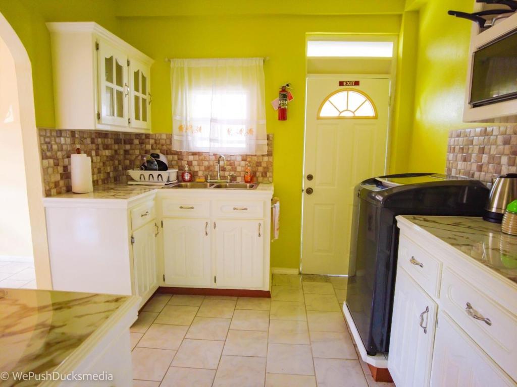 Kuchyň nebo kuchyňský kout v ubytování Coco Rose Apartments