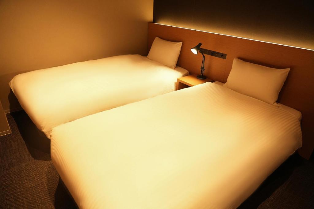 Postel nebo postele na pokoji v ubytování N Plus Hotel Akihabara