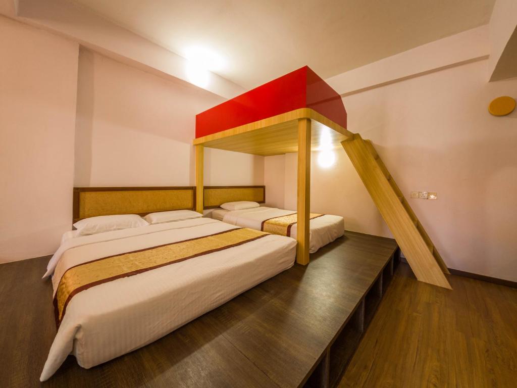 Postel nebo postele na pokoji v ubytování Miri Hotel