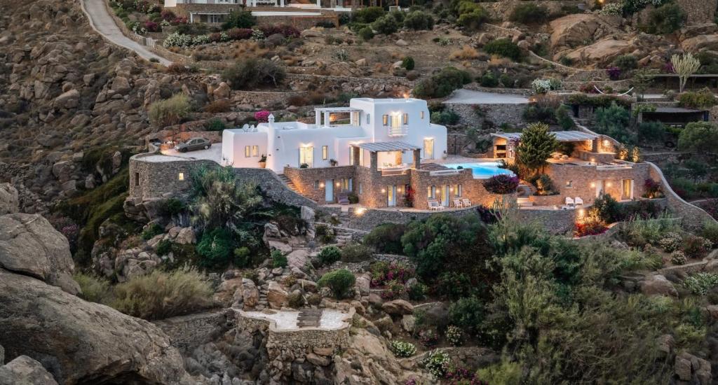 an aerial view of a house on a mountain at Rocky Mansion in Agrari