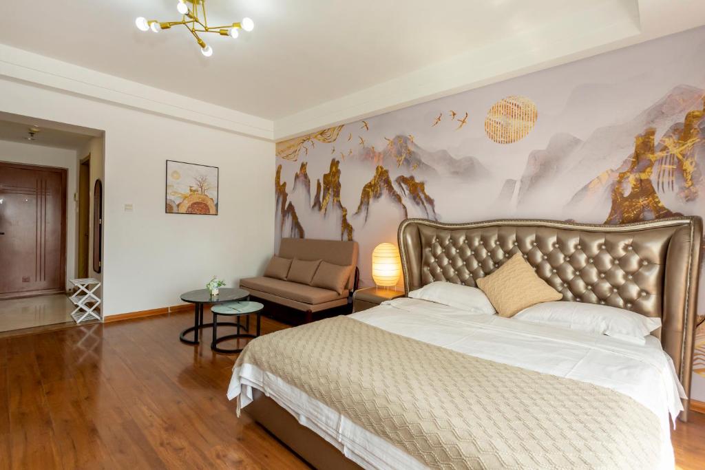 Postel nebo postele na pokoji v ubytování Dalian Hong Xi Yuan Apartment Wanda Plaza