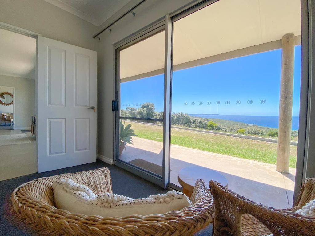 a living room with a view of the ocean at Bremer Bay B&B in Bremer Bay