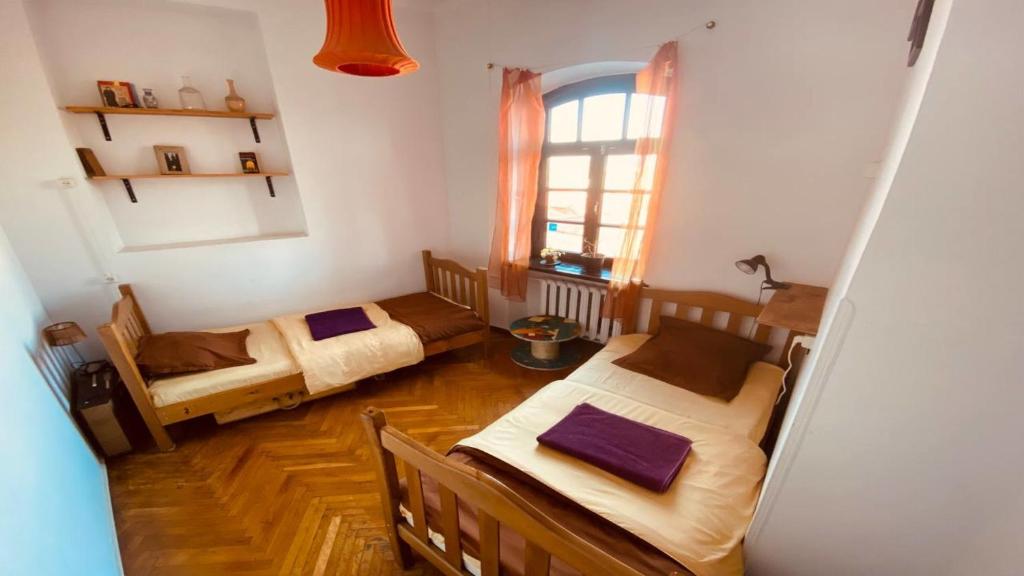 Postel nebo postele na pokoji v ubytování Namaste Hostel