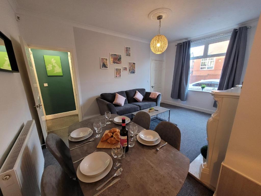 a living room with a table and chairs and a couch at Luke Stays - Rokeby Street in Lemington