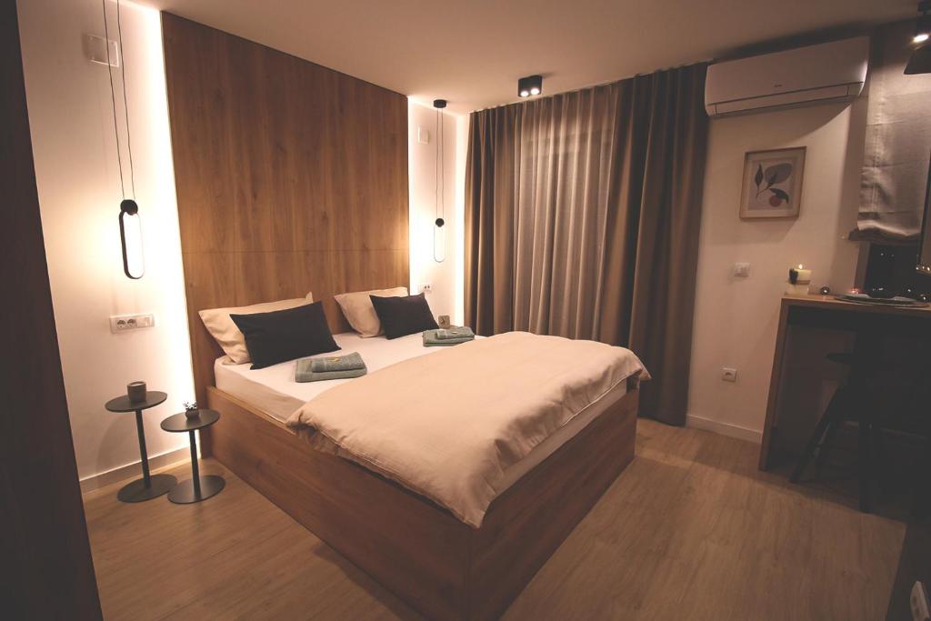 a bedroom with a large bed in a room at TOP Room in Šabac