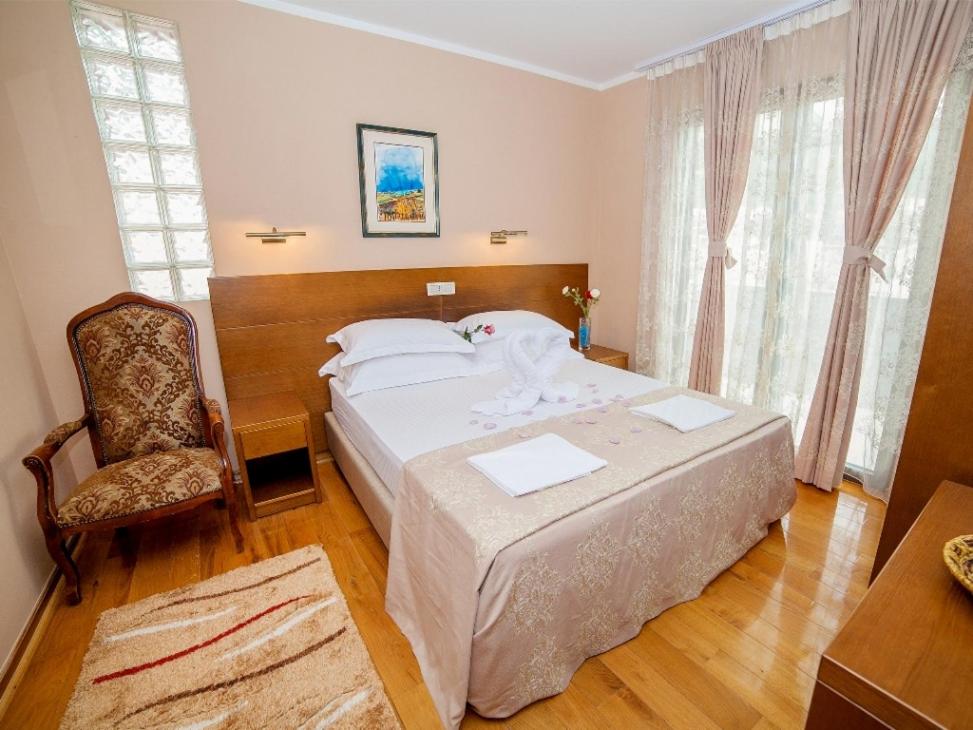 Postel nebo postele na pokoji v ubytování Hotel Petrovac