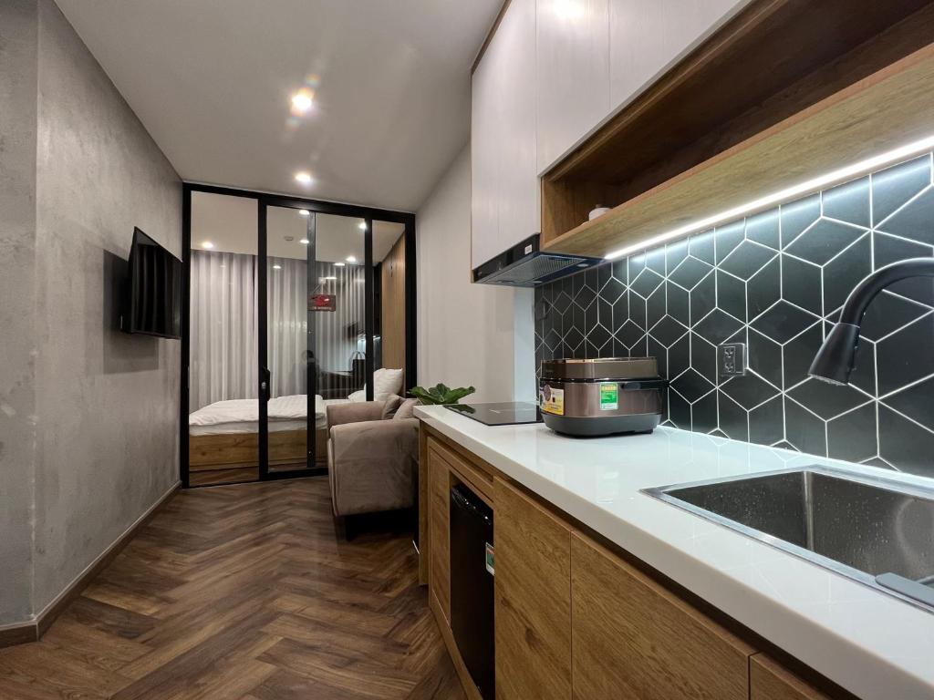 Nhà bếp/bếp nhỏ tại LE CIMENT - Apartment Hotel