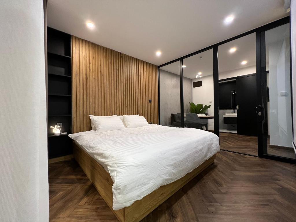 Giường trong phòng chung tại LE CIMENT - Apartment Hotel