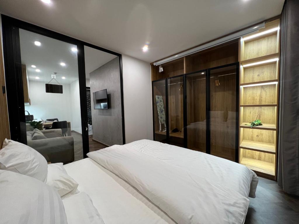 Giường trong phòng chung tại LE CIMENT - Apartment Hotel