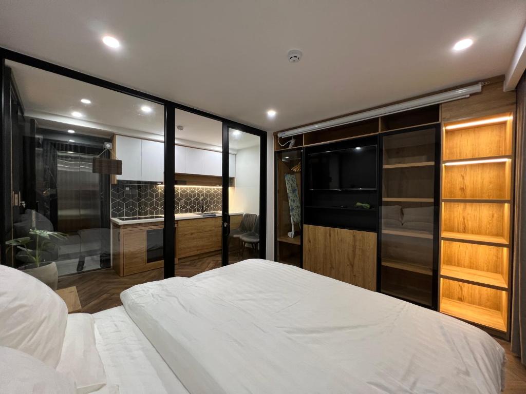Giường trong phòng chung tại LE CIMENT - Apartment Hotel