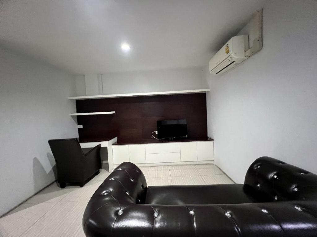 Posezení v ubytování INN Kham Apartment