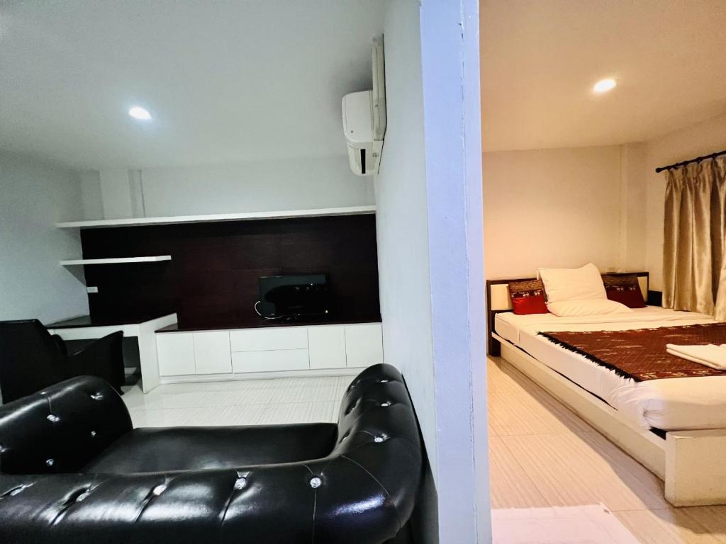 Postel nebo postele na pokoji v ubytování INN Kham Apartment