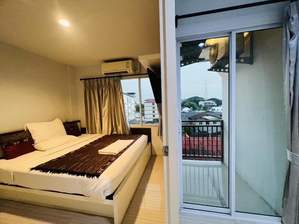 Postel nebo postele na pokoji v ubytování INN Kham Apartment