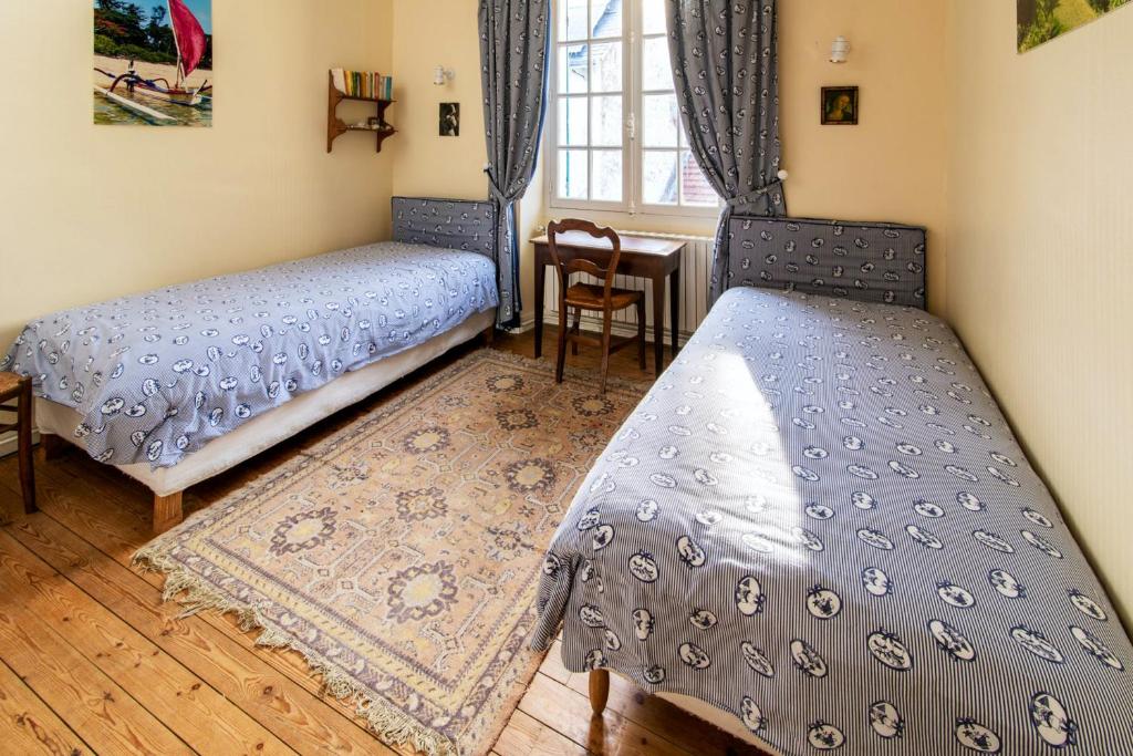 Posteľ alebo postele v izbe v ubytovaní Maison charmante au Pouliguen avec accès direct à la plage